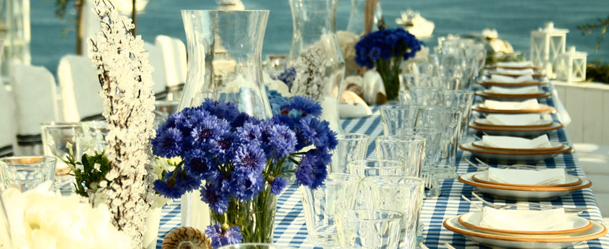destination wedding blue flowers and table lake view 1